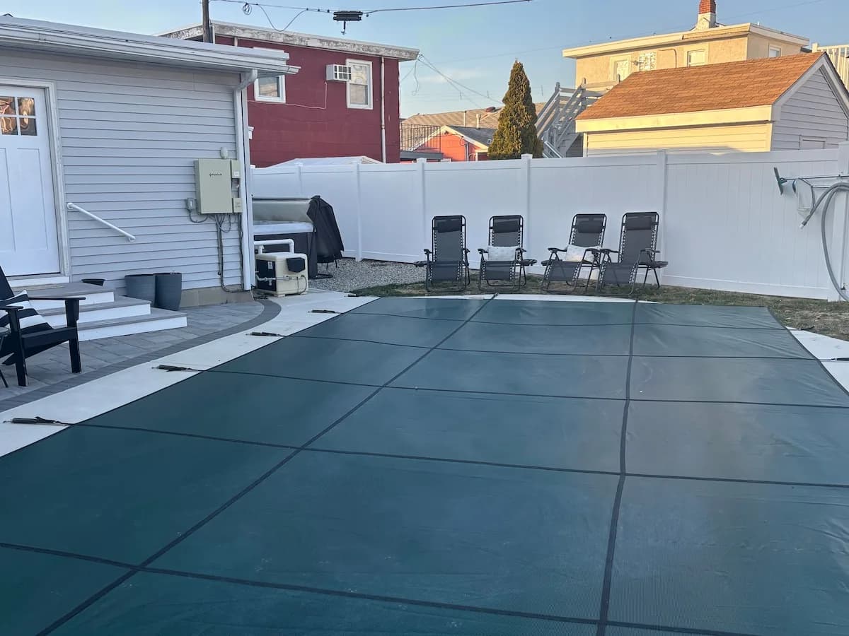 Heated private pool across the fenced Buttercup backyard