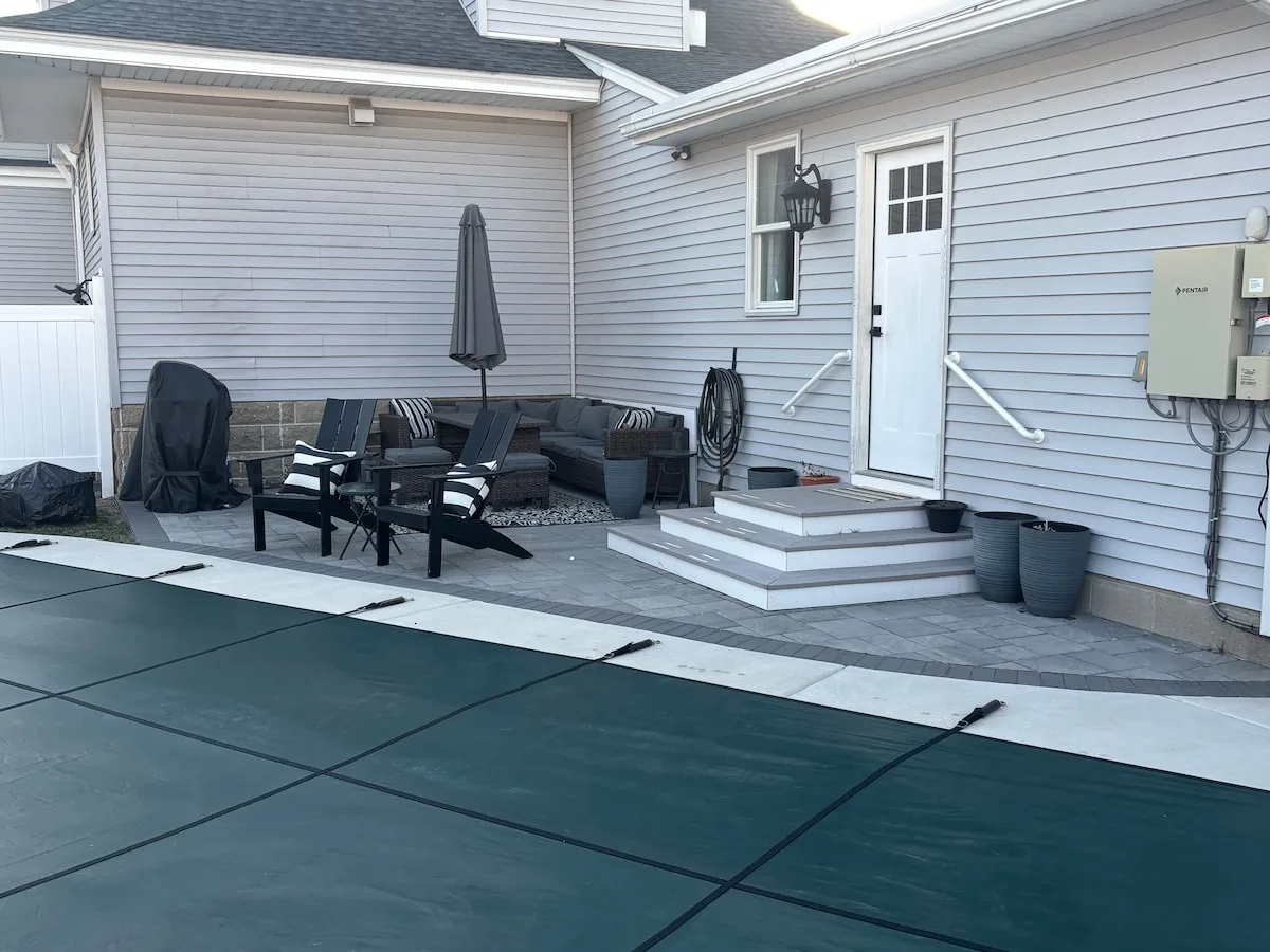 Steps from the pool patio into the house