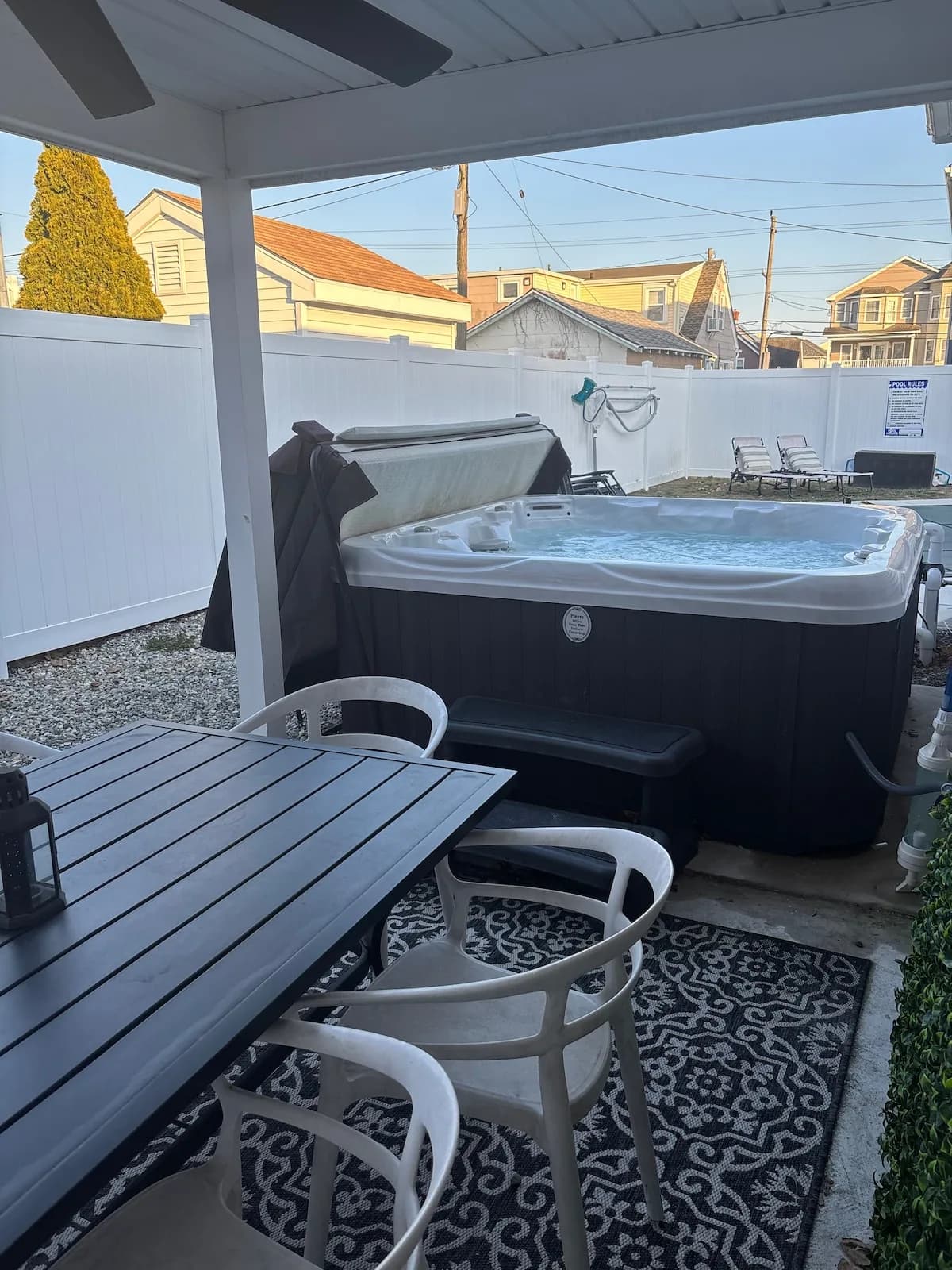 Covered outdoor dining beside the private hot tub
