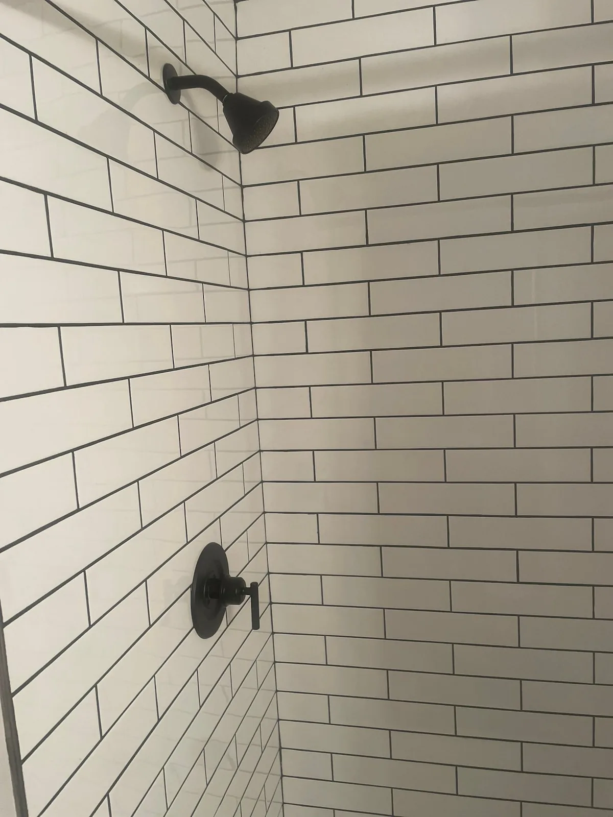 Subway-tile shower with matte black fixtures
