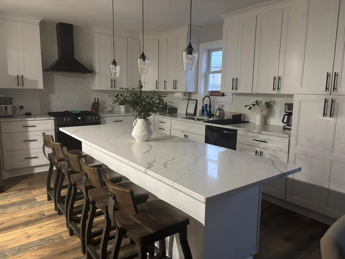 Expansive white kitchen island with seating for five