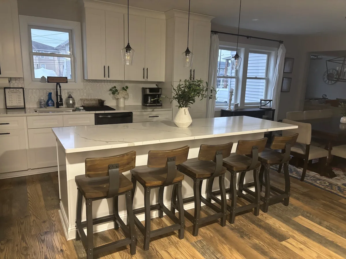 Kitchen island and counter seating viewed from the dining room