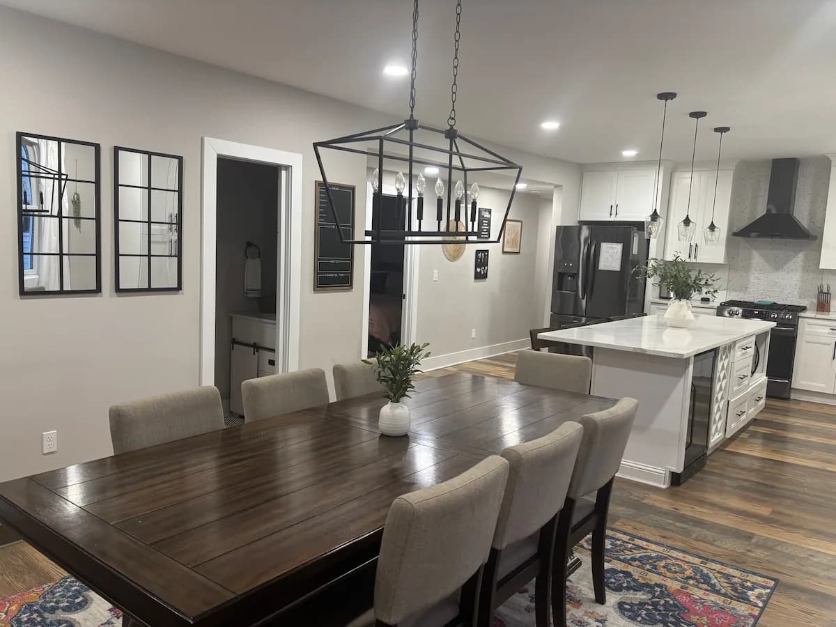 Dining table and statement lighting in the open-plan interior