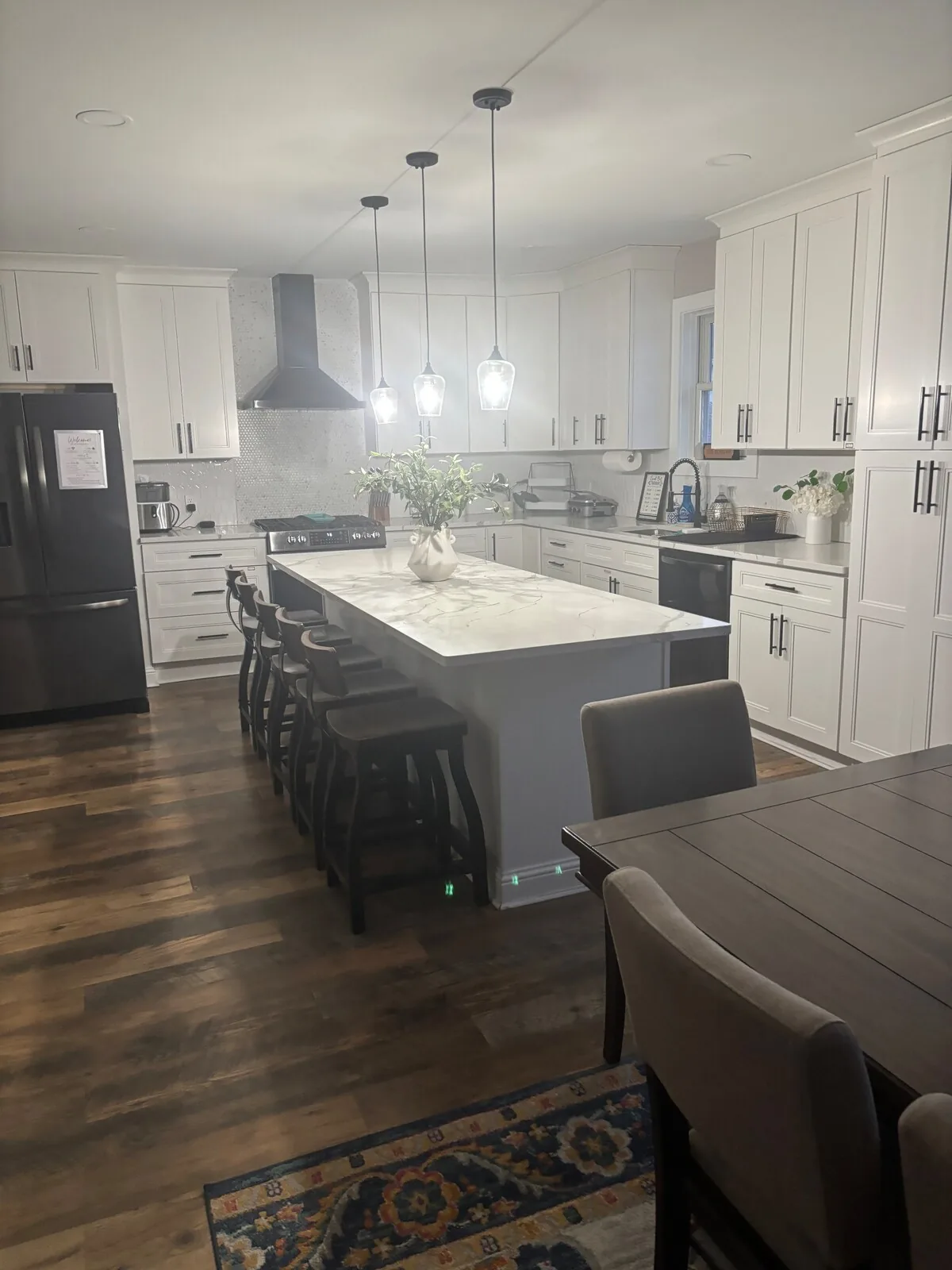 Kitchen and dining spaces viewed from the central hallway