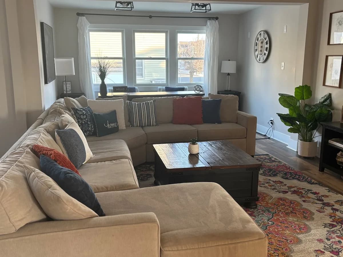 Oversized sectional arranged around the living room coffee table