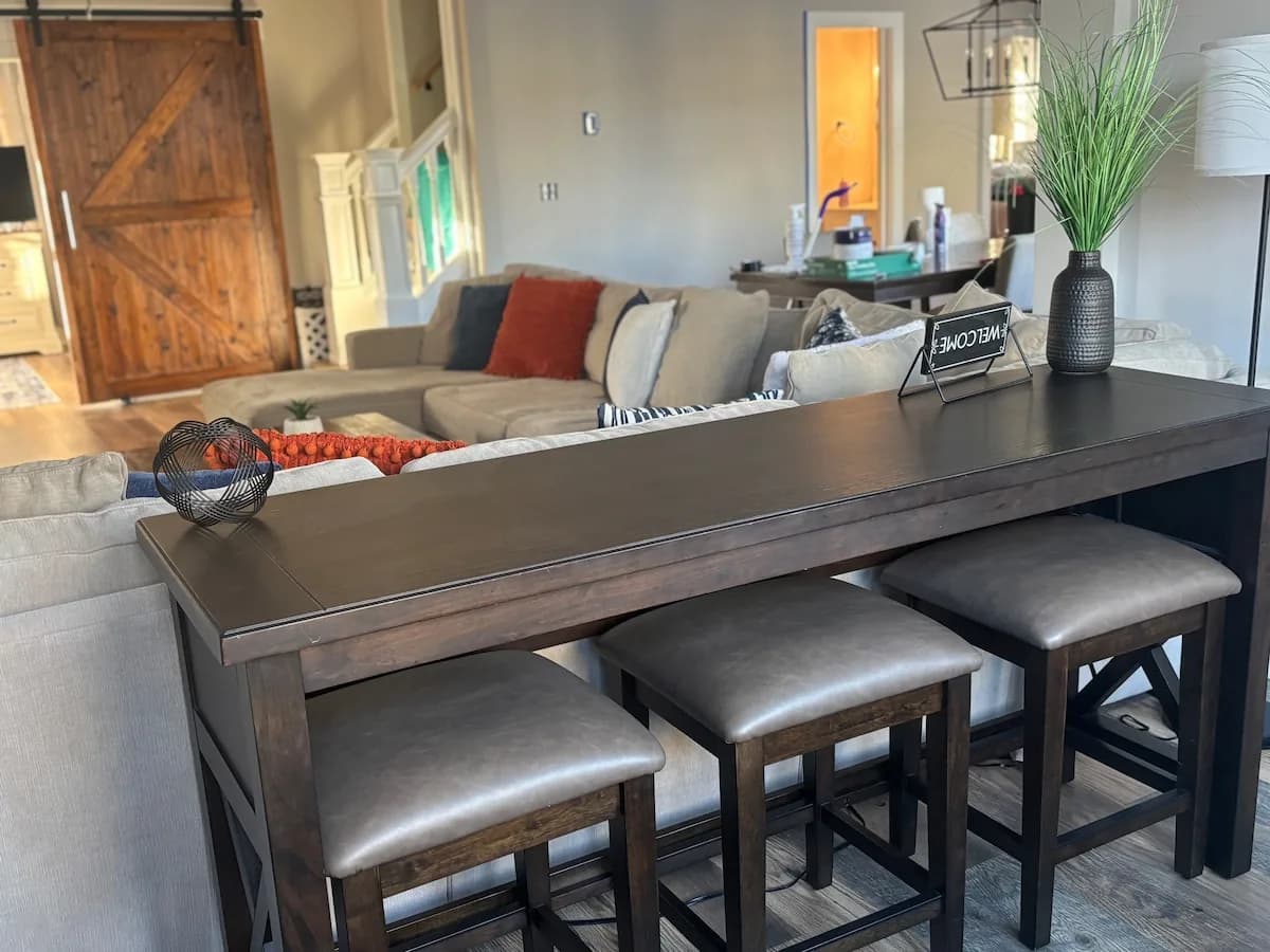 Sofa table seating behind the main sectional