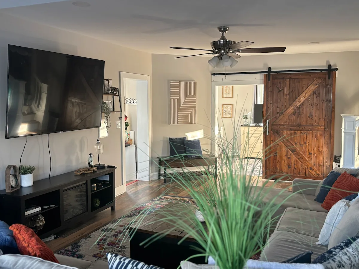 Sliding barn door and flexible seating beside the living room