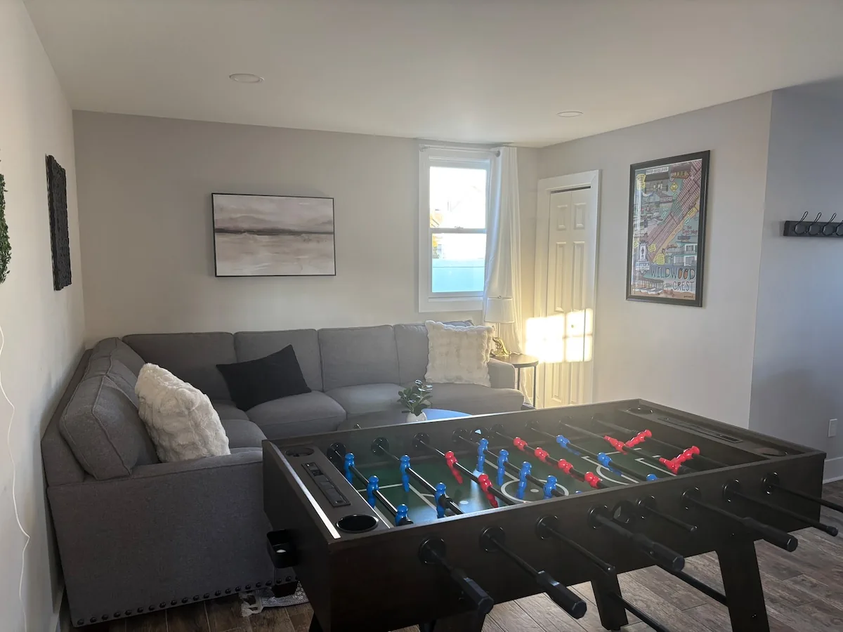 Game room with foosball and sectional seating