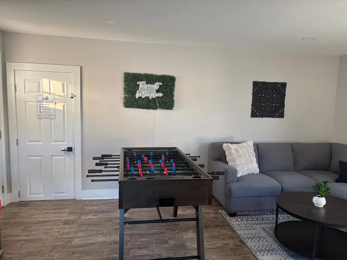 Foosball table at the center of the game room