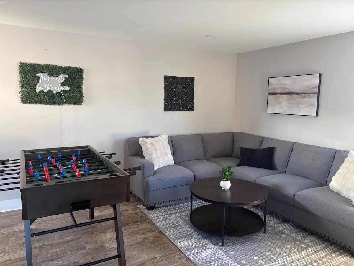 Wide game room with lounge and high-top seating