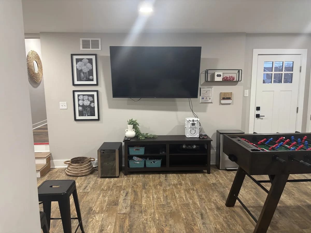 Television and foosball area in the game room
