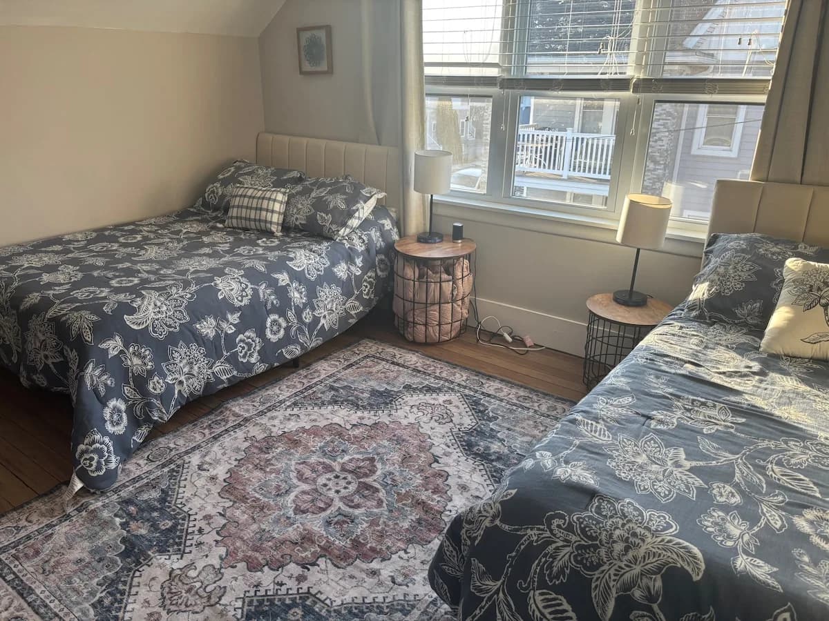 Bedroom with two coordinating beds for family groups