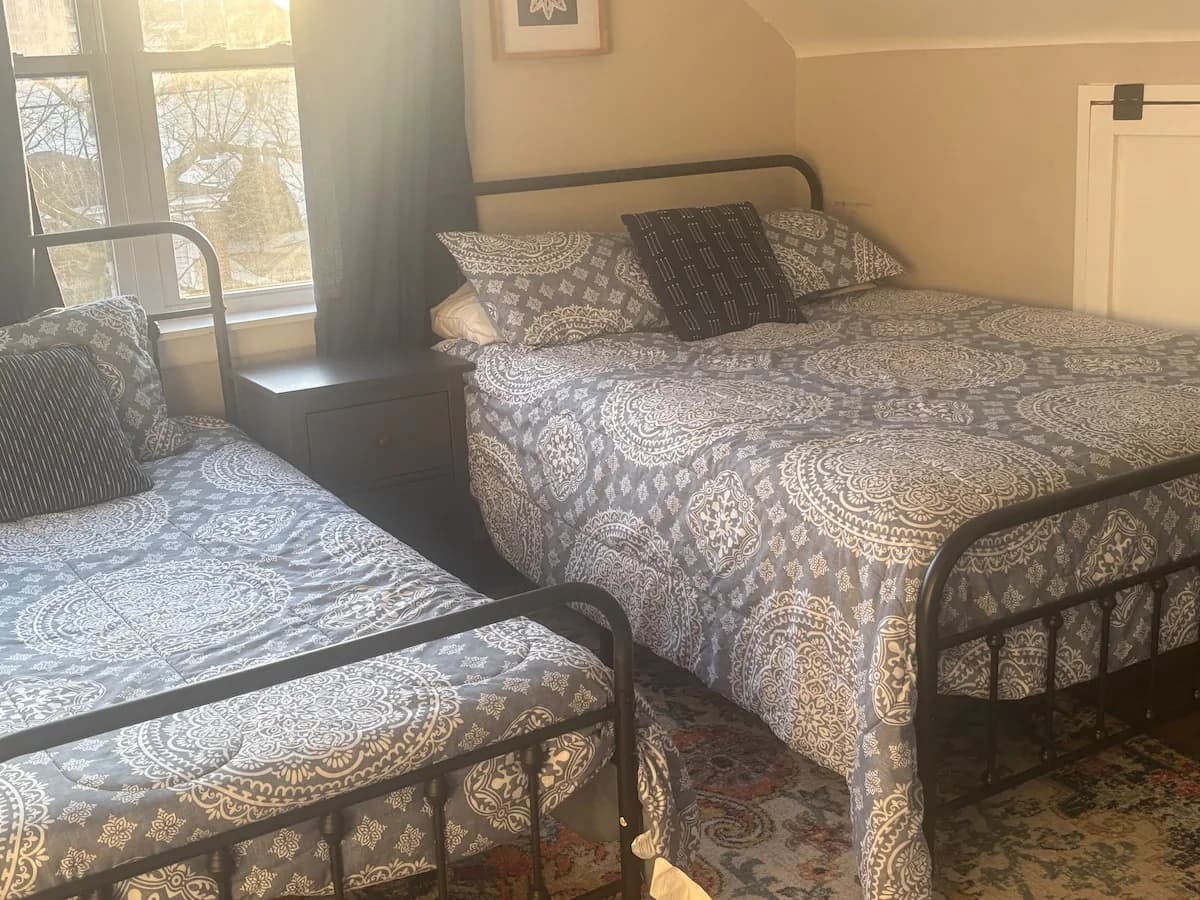 Upstairs twin bedroom with coordinated bedding