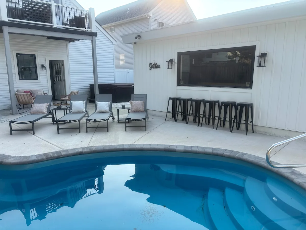 Poolside bar seating beneath the converted bonus room