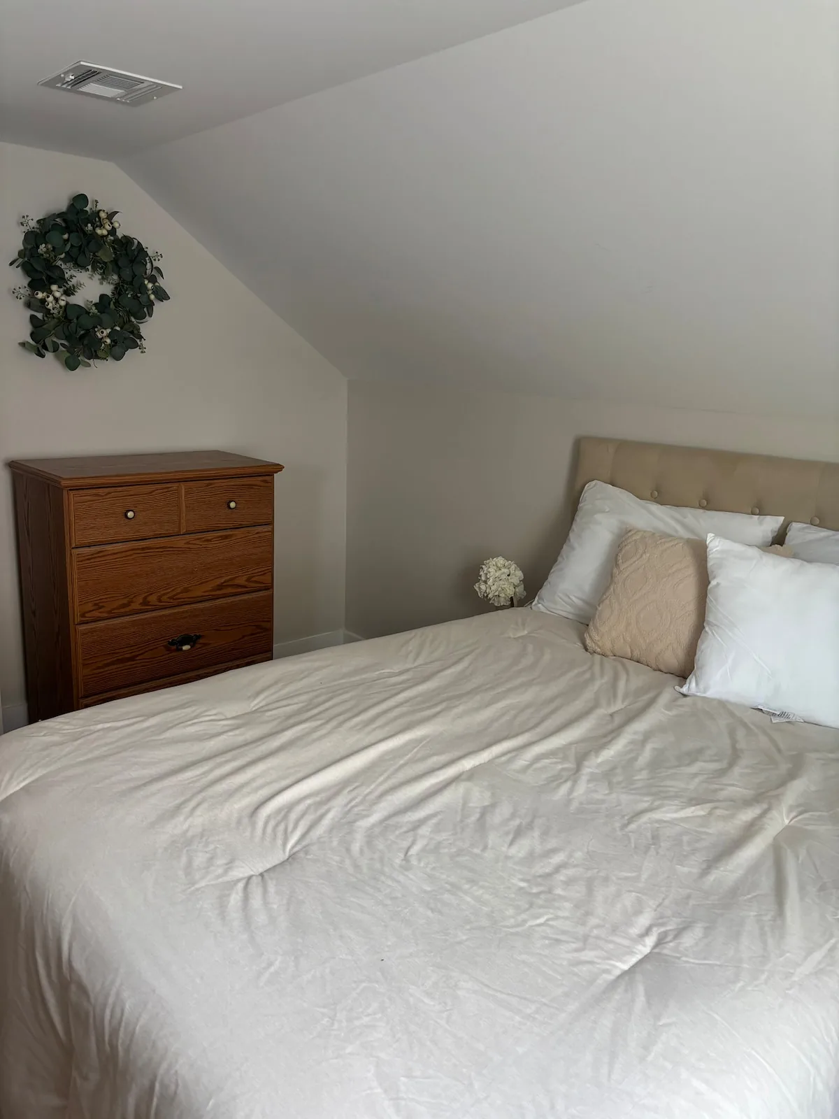 Guest bedroom with soft neutral bedding
