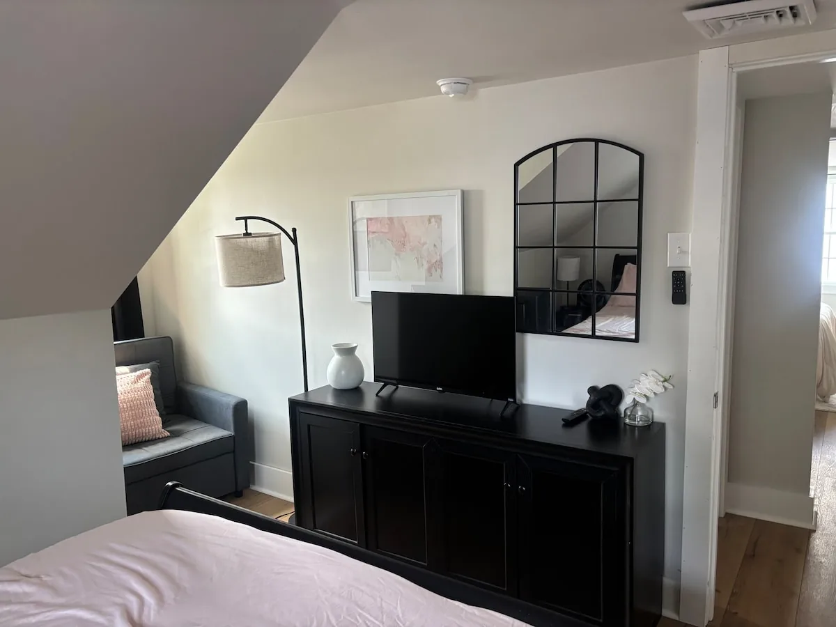 Bedroom media console and full-length mirror