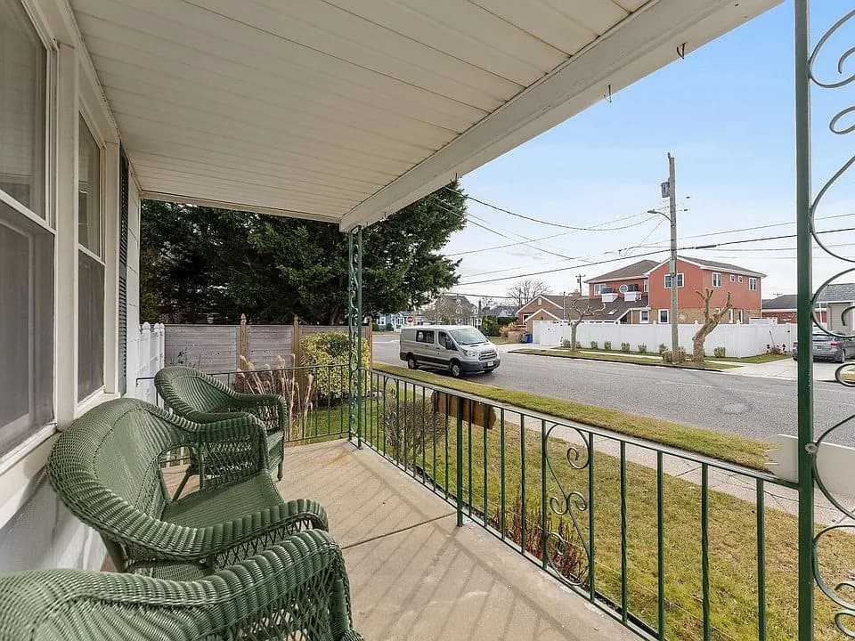 Covered front porch with seating for a quiet morning