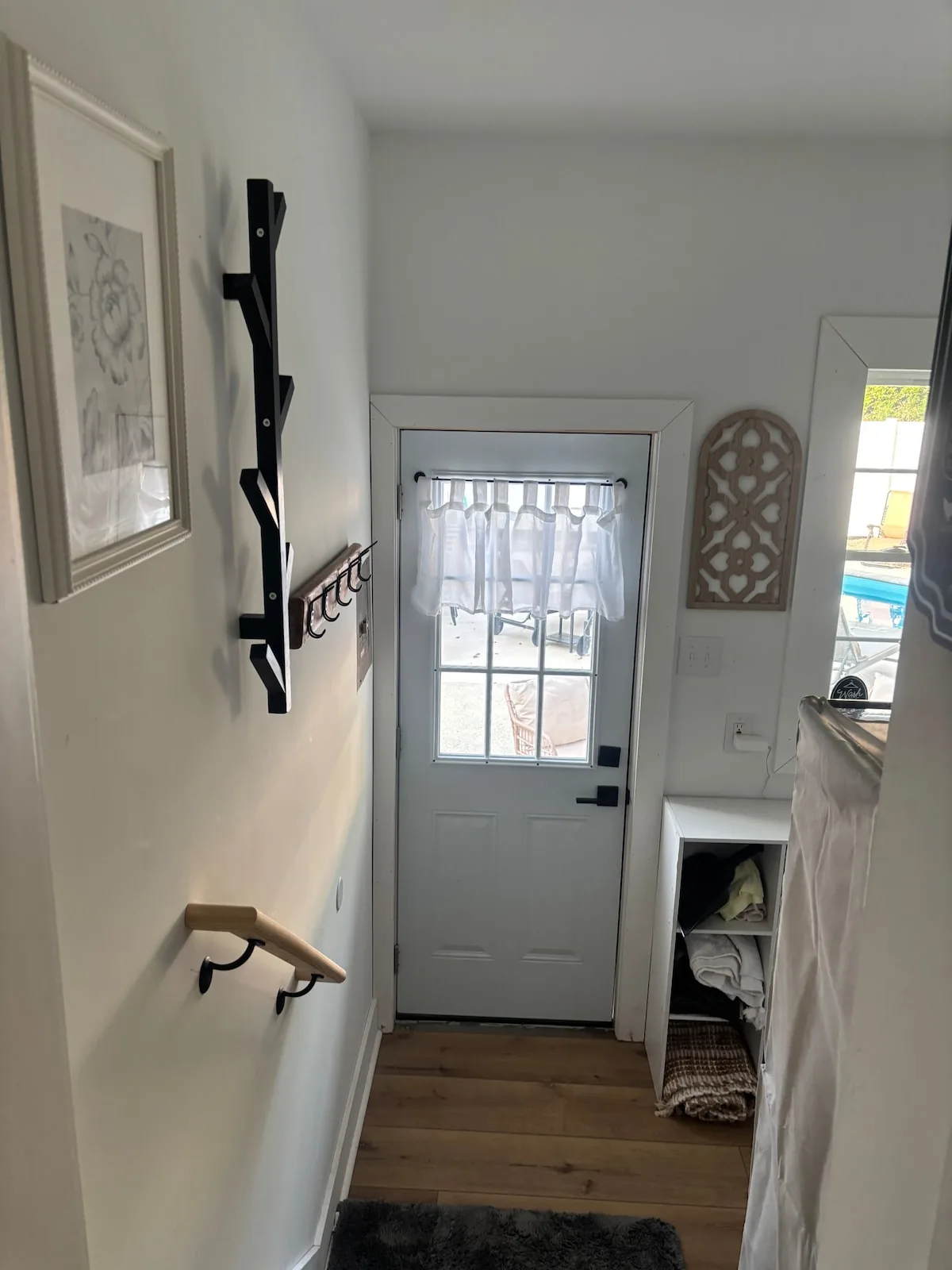 Side entrance with a simple Wildwood welcome