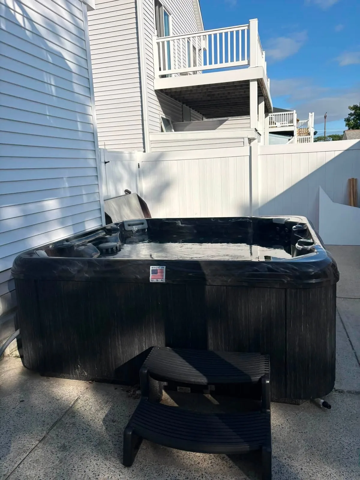 Close view of the hot tub beneath the open sky
