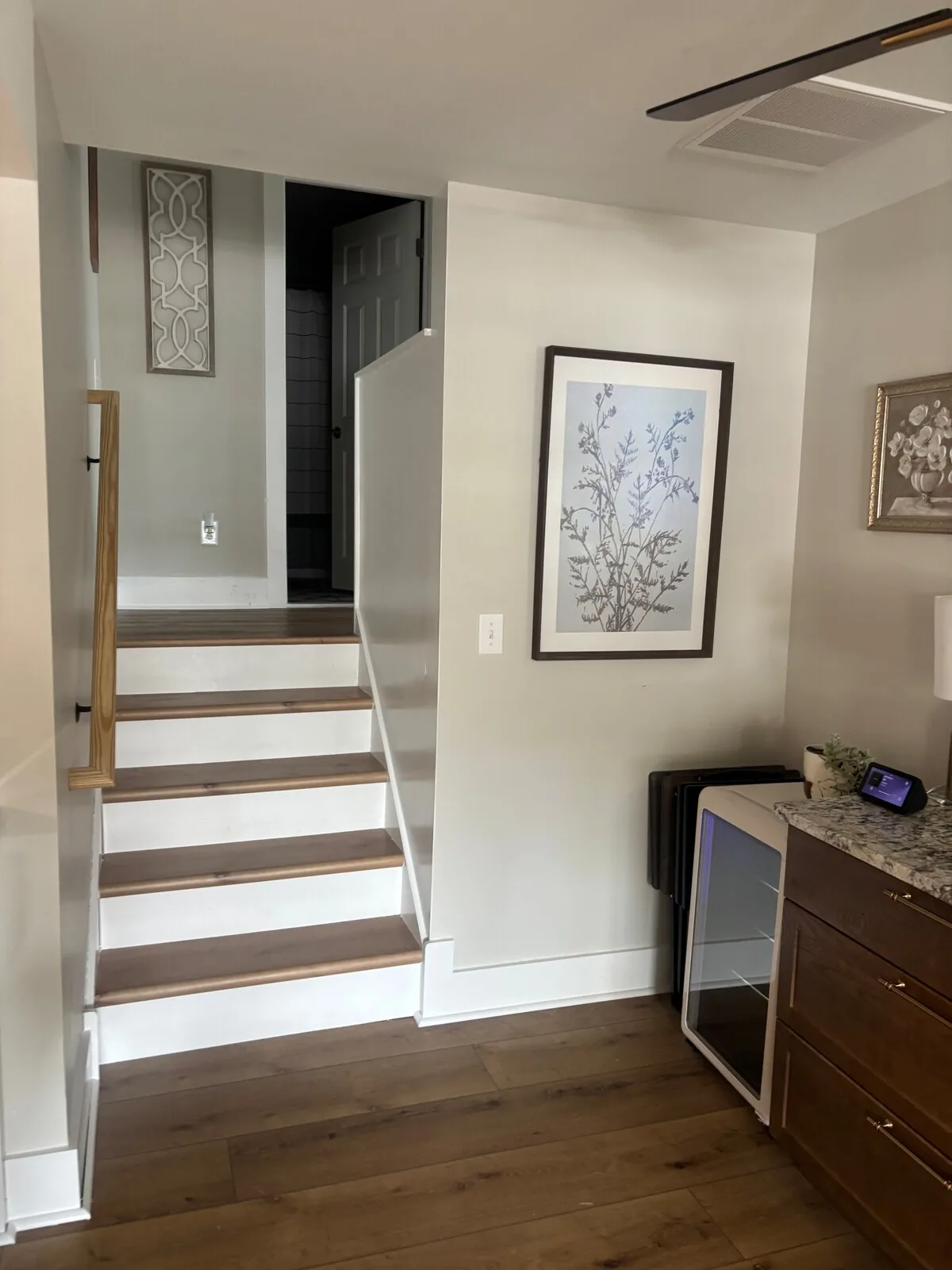 Interior stair and landing connecting the home’s levels