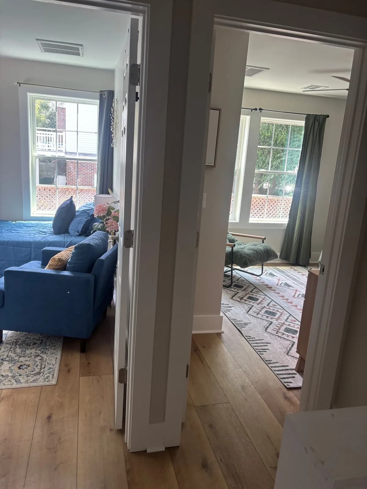 Blue guest room tucked beyond the upstairs hall