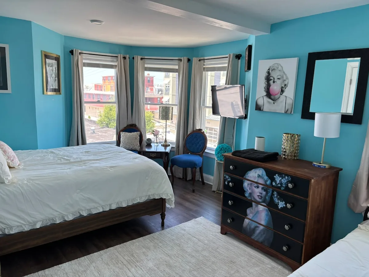 Colorful bay-window bedroom with layered Wildwood character