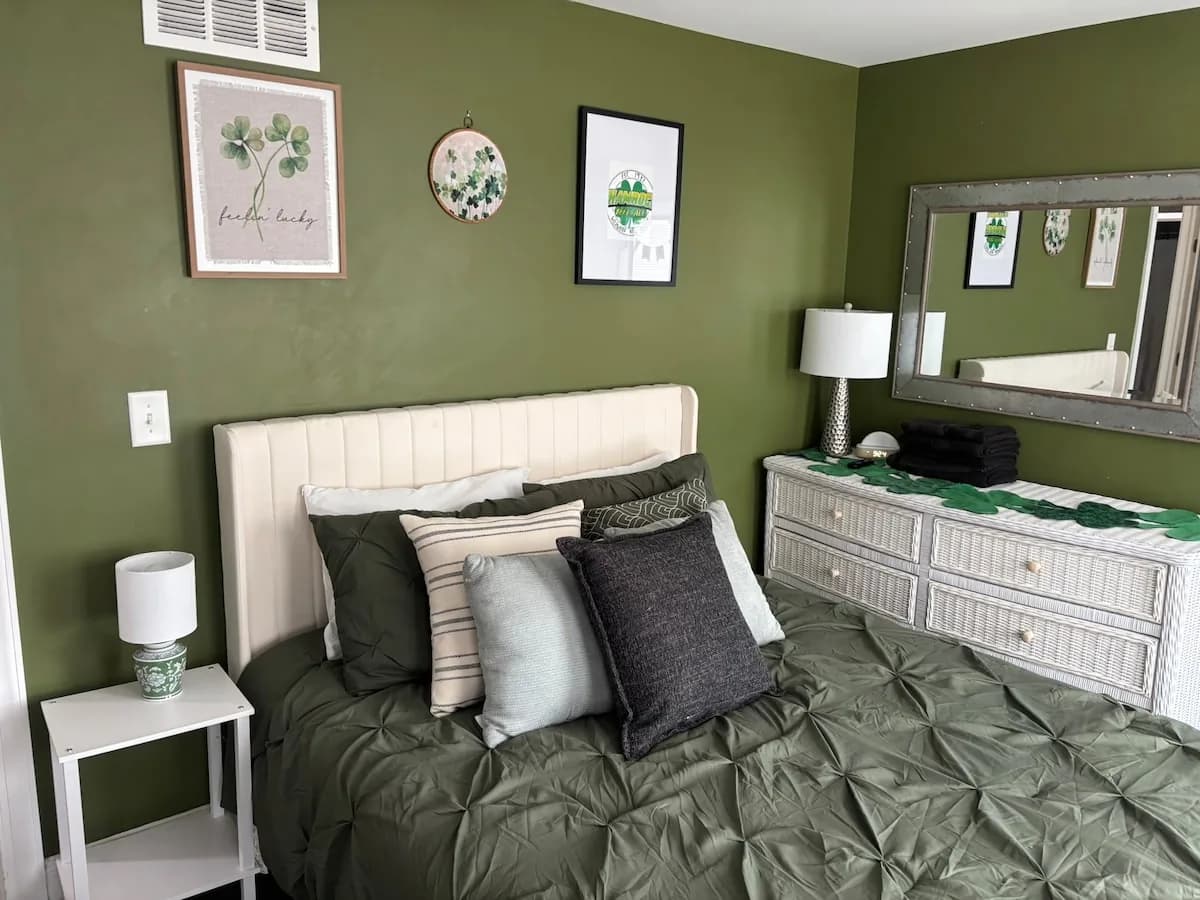 Deep green bedroom with botanical Shamrock details