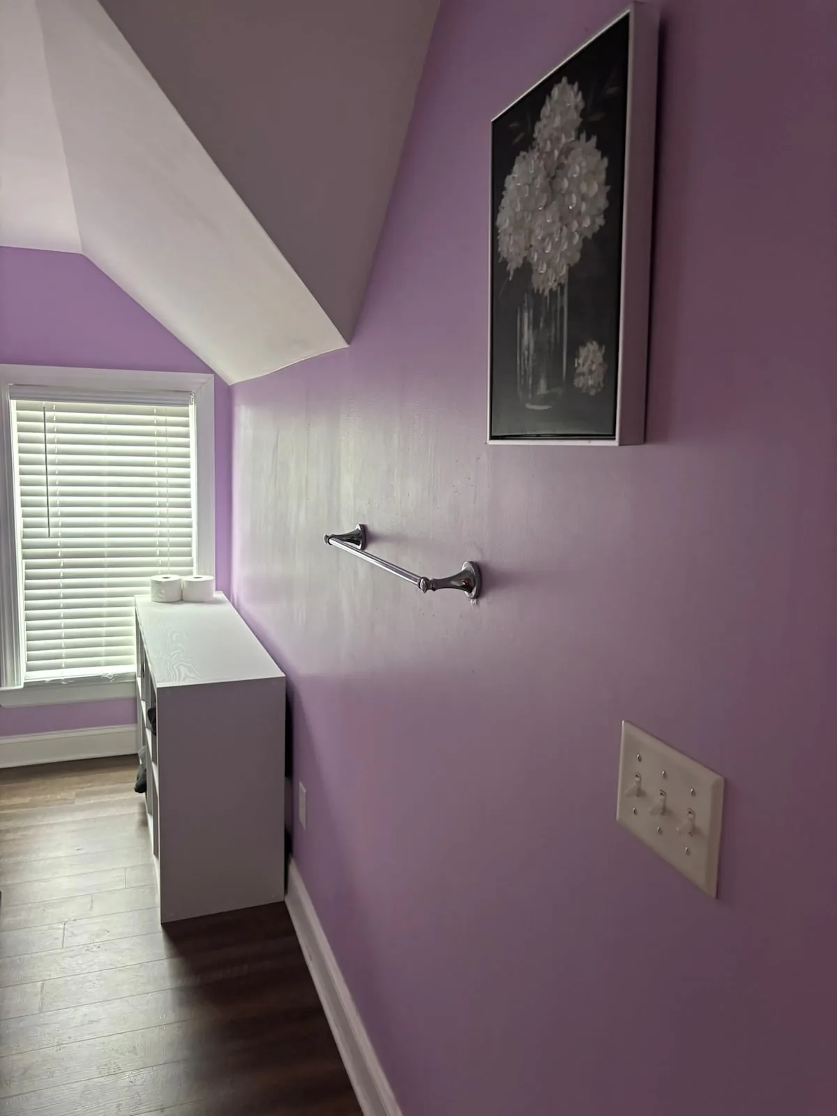 Lavender bathroom tucked beneath the roofline