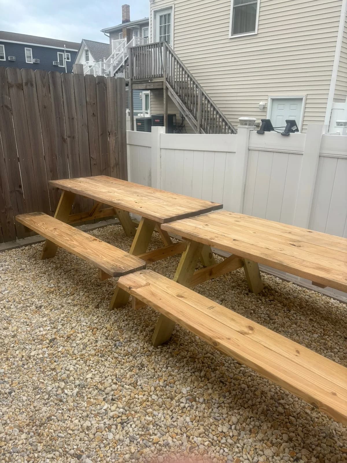 Backyard picnic tables ready for a group meal