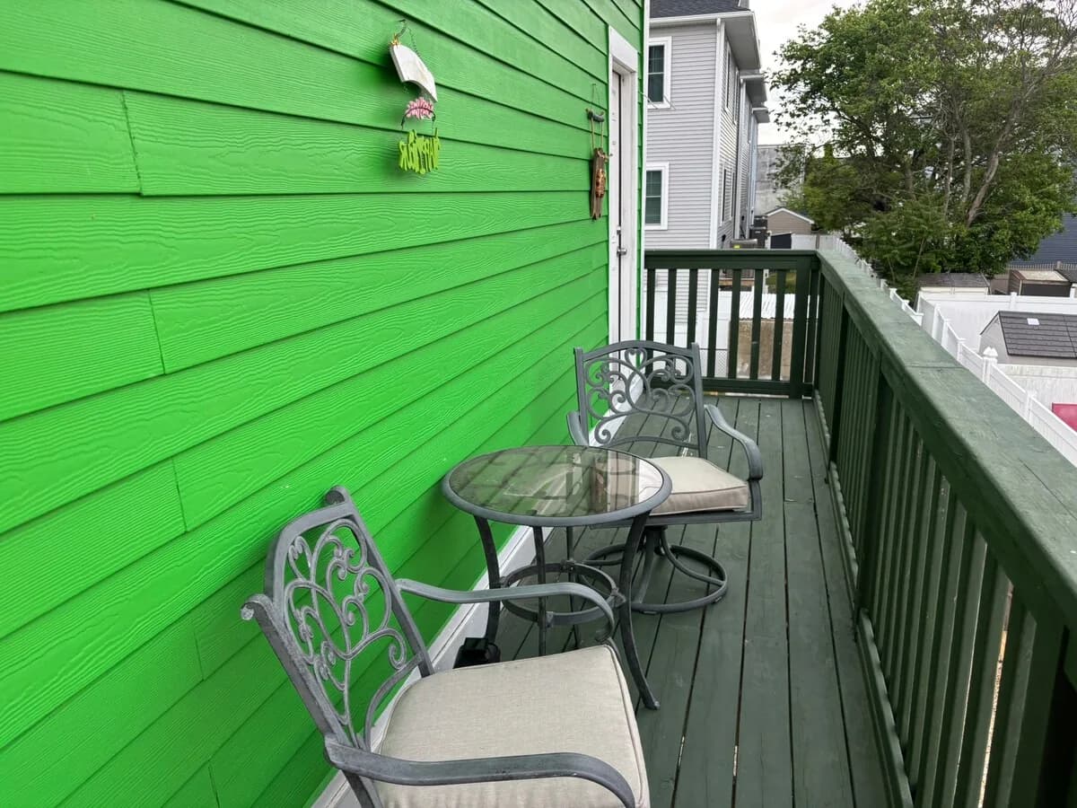 Green side deck with café seating